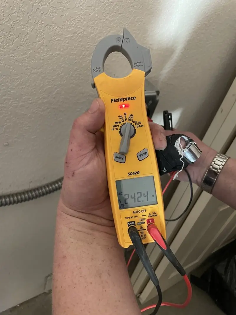 Voltage testing with clamp meter during Electrical Installation Services in Forest Hills